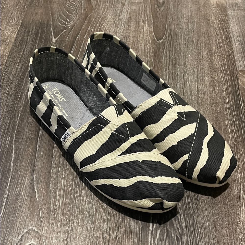 TOMS Black and Cream Animal Print Slip-Ons